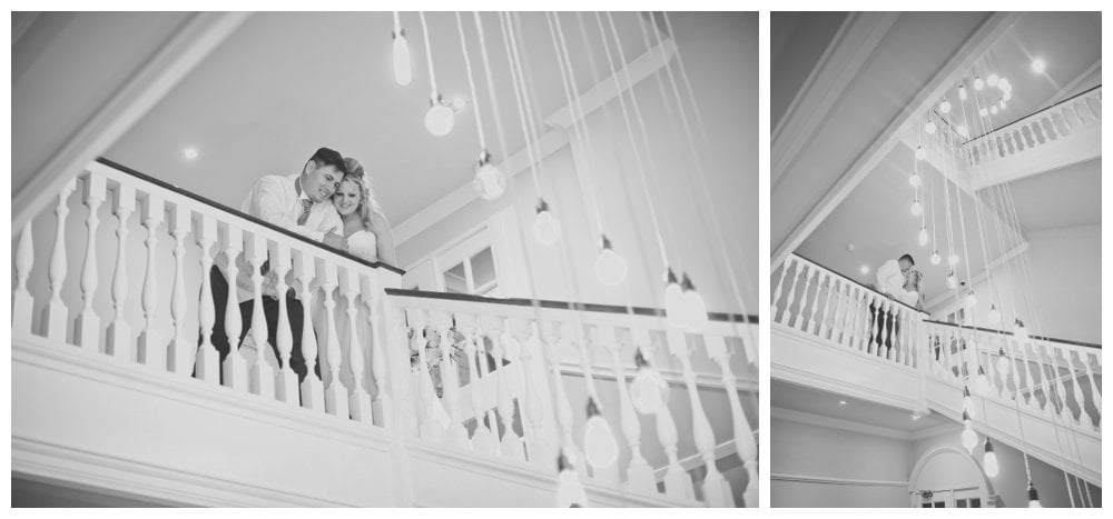 Black and white photographs of Bride and groom on staircase at Balmer Lawn
