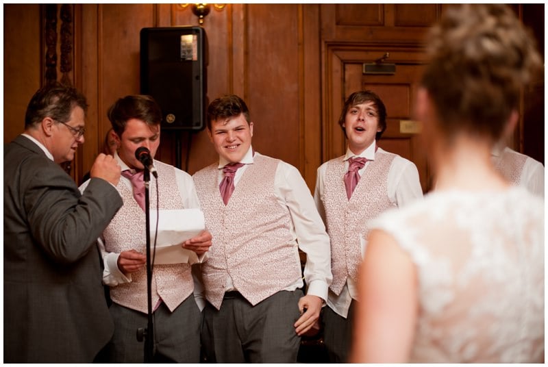 Photograph of Groom and family singing to Bride