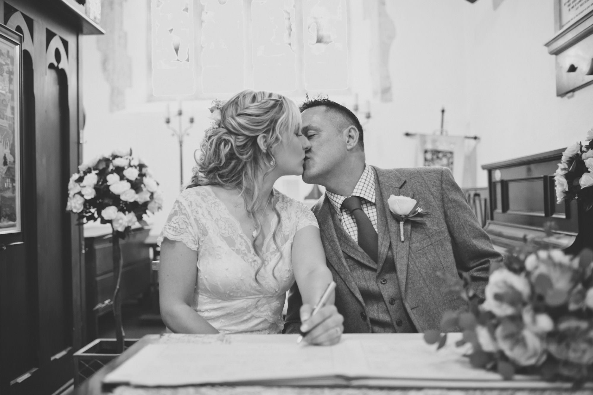 Signing wedding register at Sopley Church