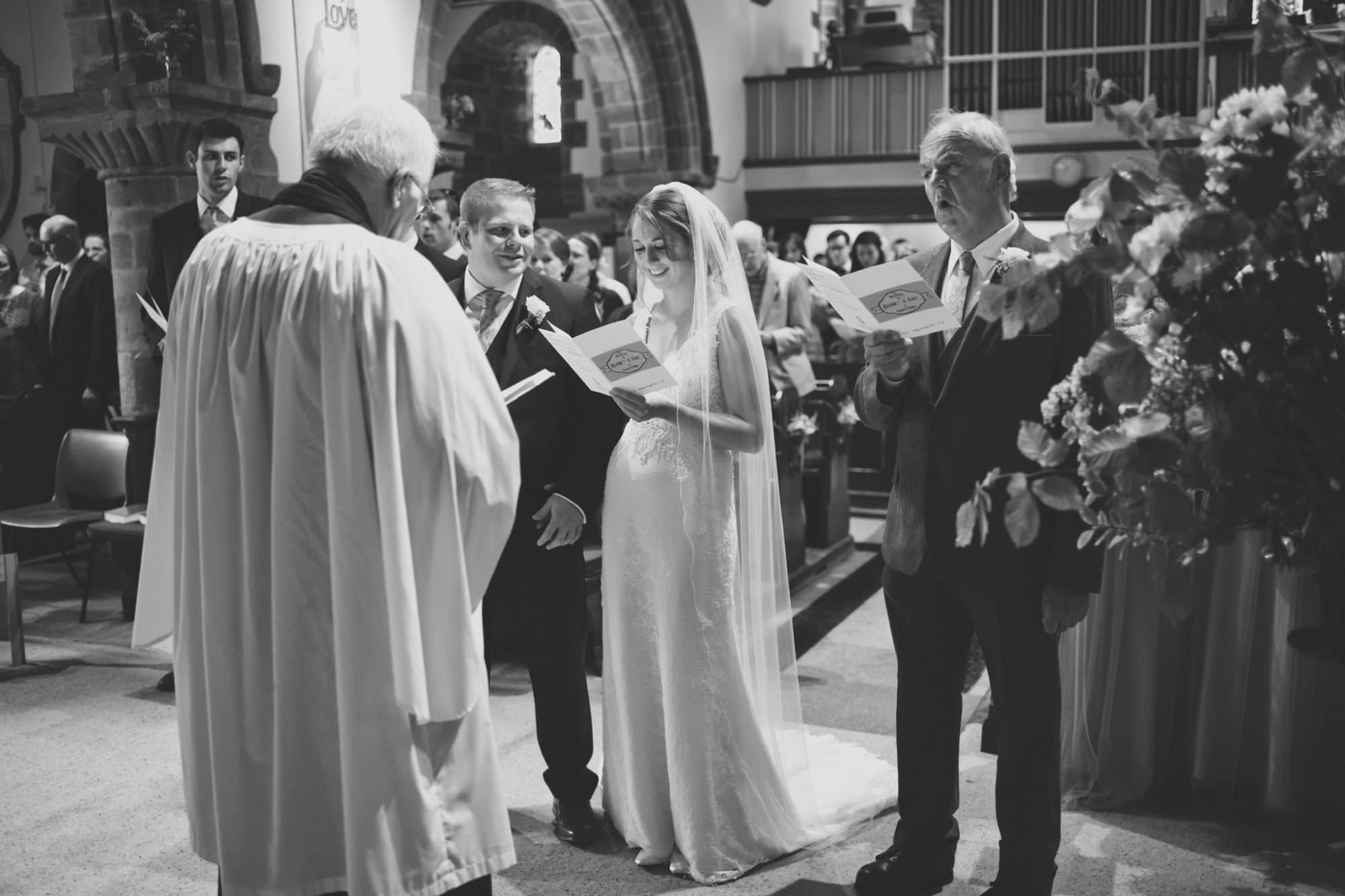 Singing hymns at Canford magna church wedding