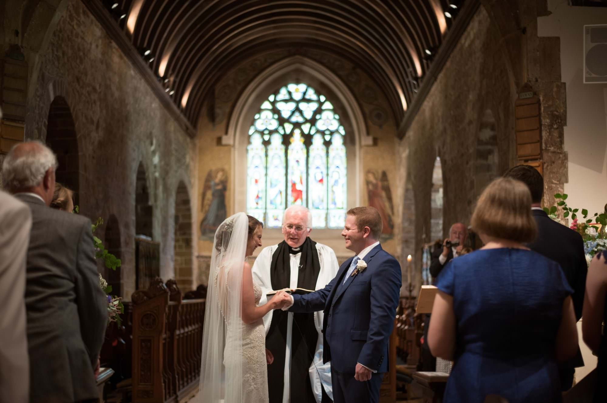 Ring exchange at Canford magna church wedding