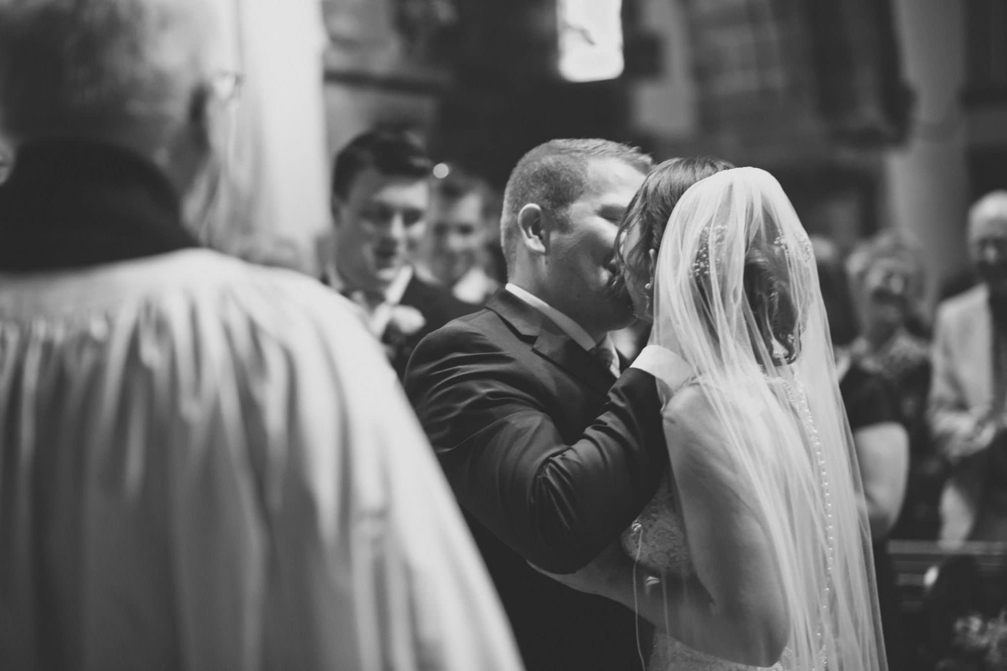 First Kiss at Canford magna church wedding