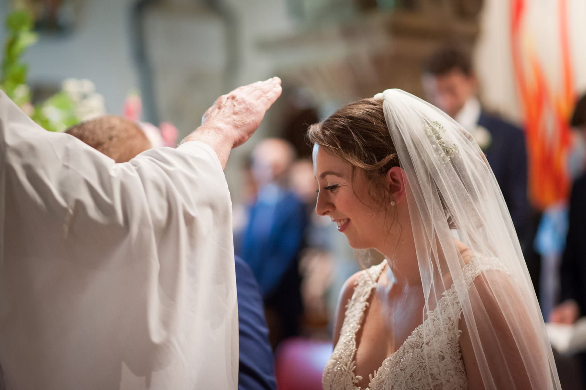 Wedding prayer at Canford magna church wedding