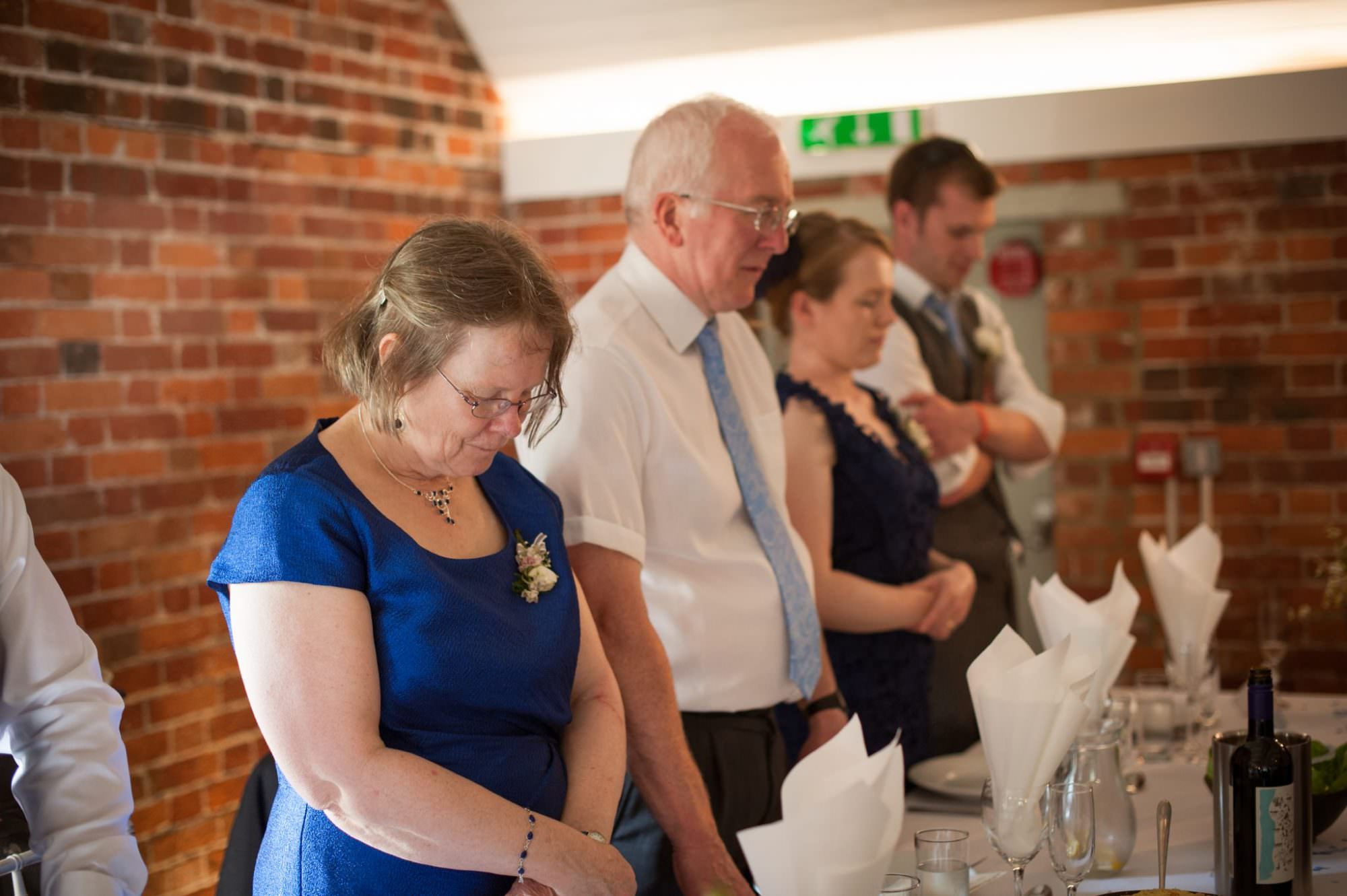 Saying grace at Sopley Mill wedding breakfast