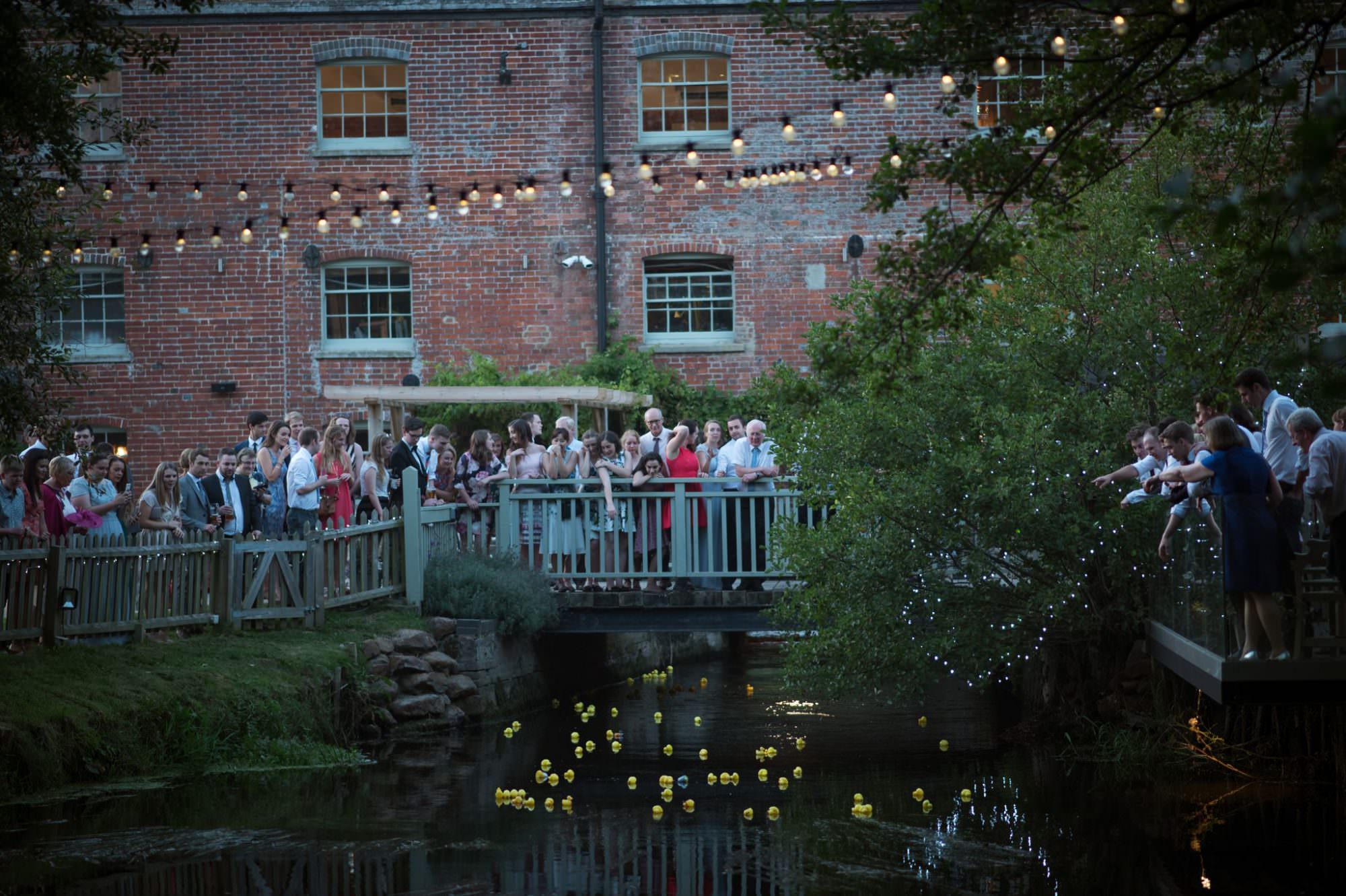 Dorset wedding photography at Sopley Mill duck race fun