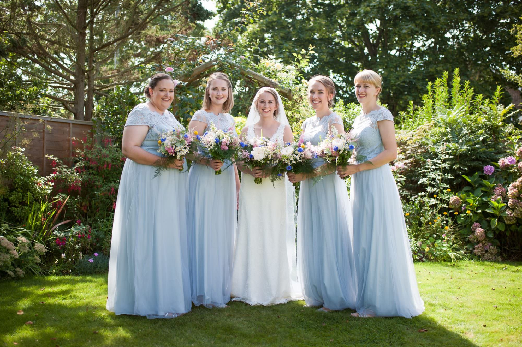Dorset Wedding photographer taking photo of bride tribe