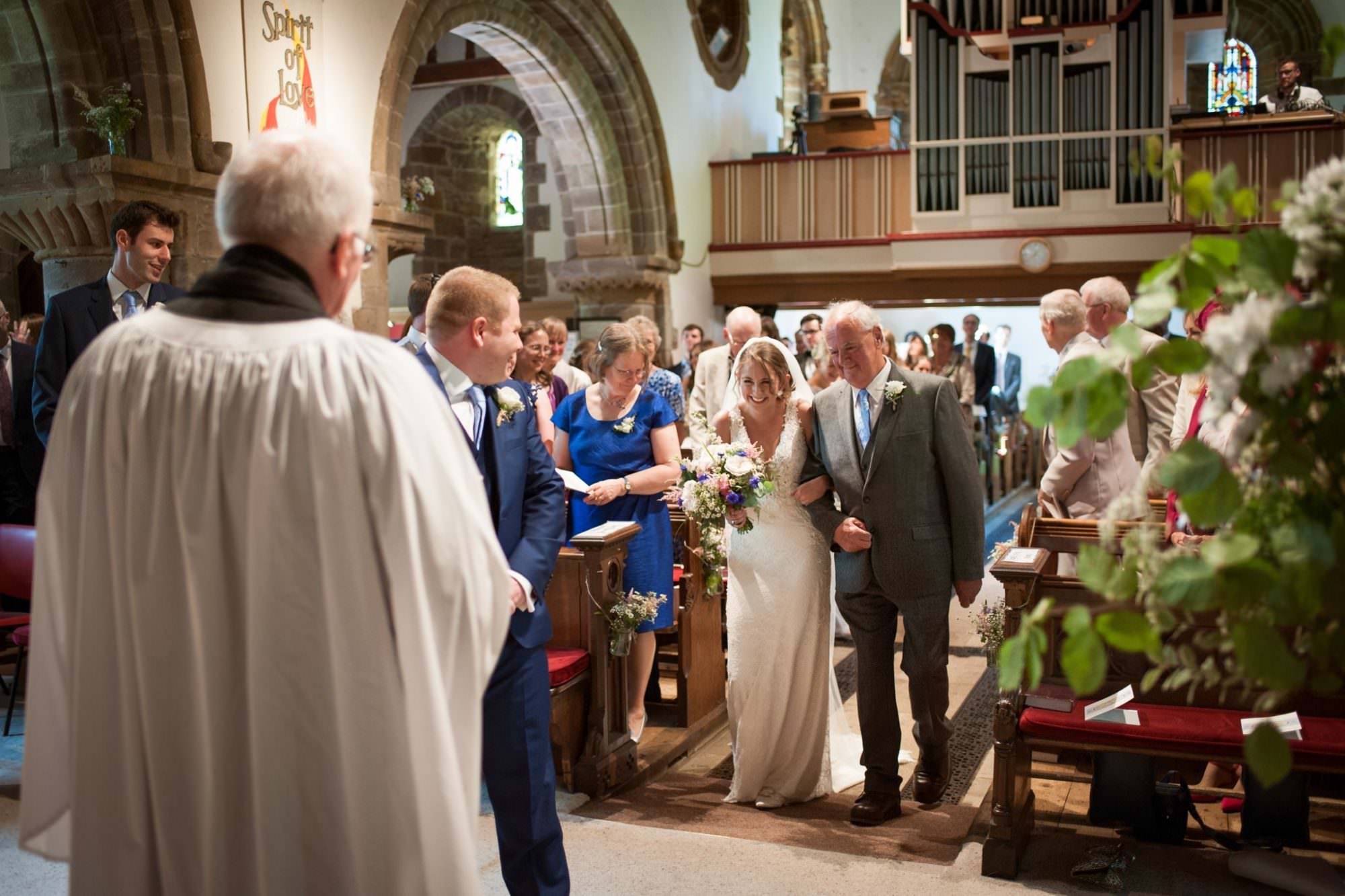 bride and groom at Canford magna church wedding in dorset