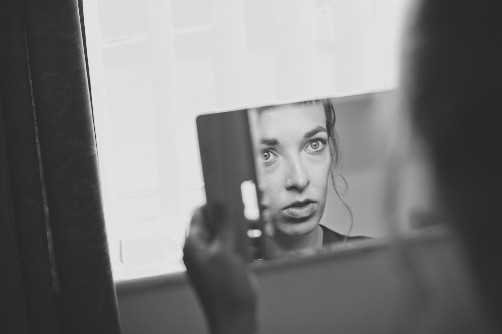 Photograph of Bridesmaid reflection after having makeup by Barnet & Boatrace