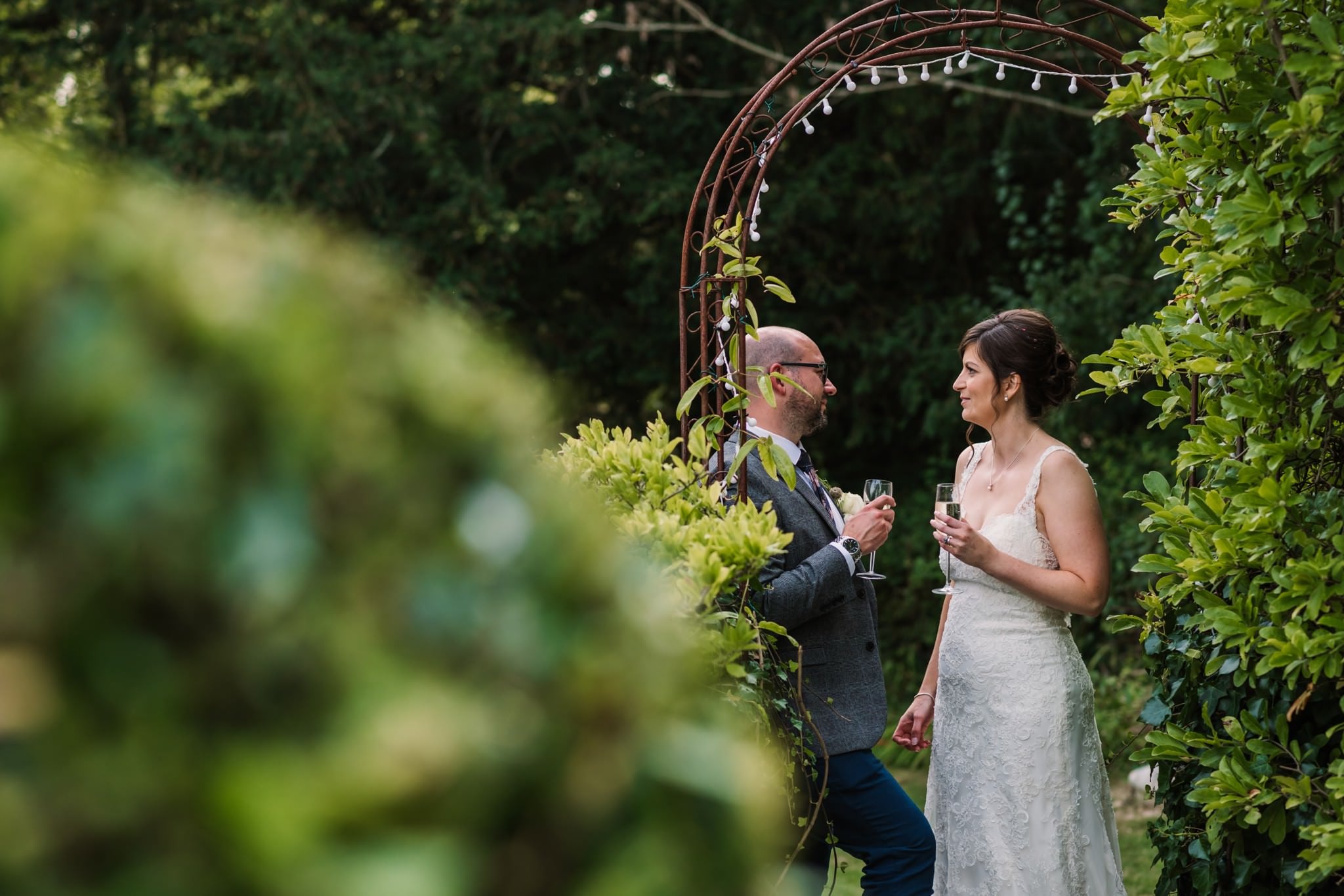 Bride and groom with champagne at Gordleton Mill Wedding