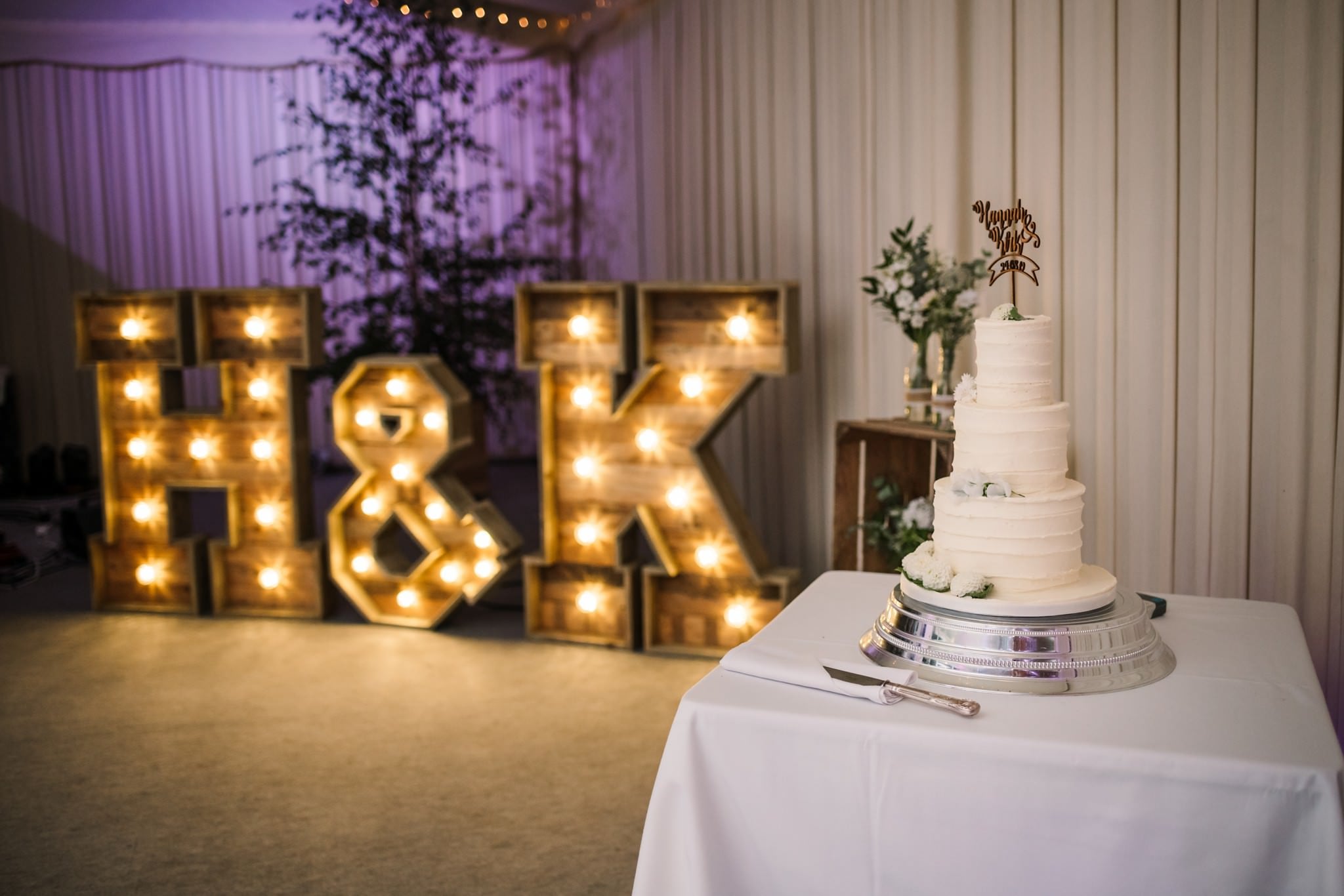 Wedding cake and light up letters at Gordleton Mill Wedding